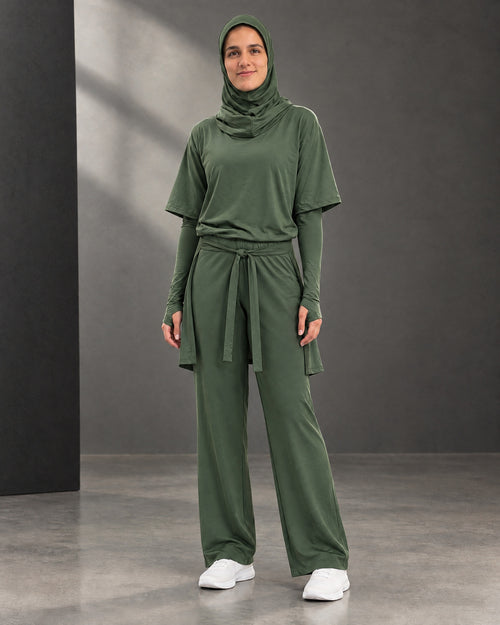The olive three-piece sitr-ha set styled with the optional hijab, sold separately.