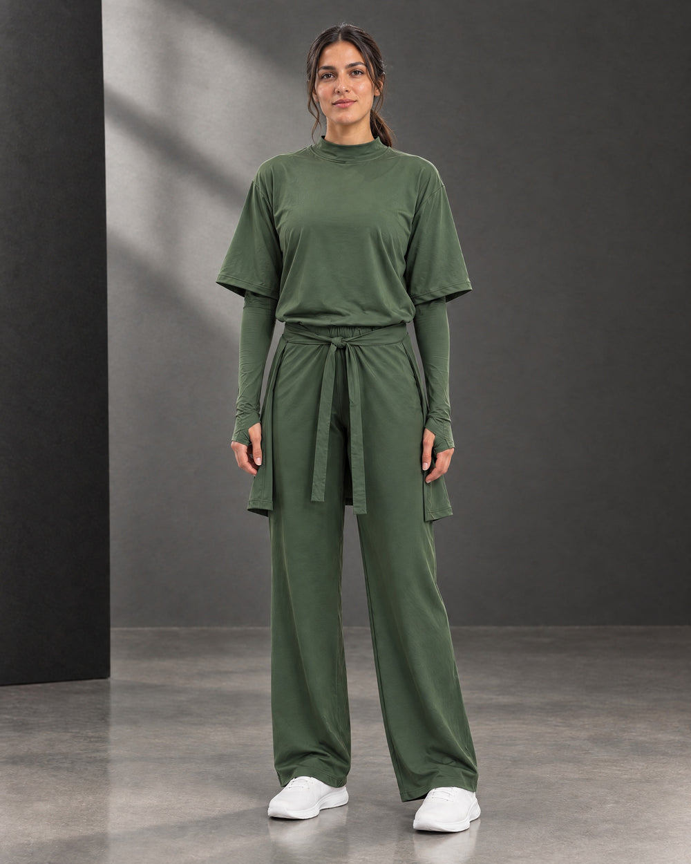 Olive three-piece sitr-ha set styled without a hijab.