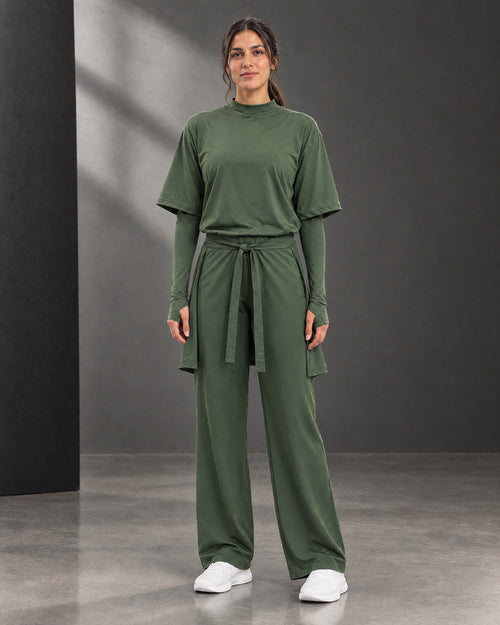 The olive three-piece sitr-ha set styled without a hijab.
